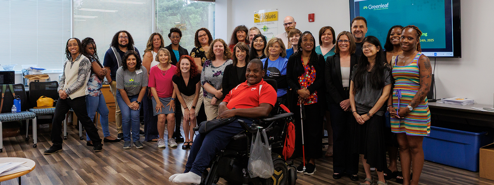 All the Greenleaf staff smiling at the camera in a group photo