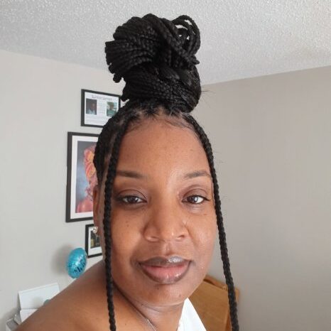 A person with braided hair AI-generated content may be incorrect_